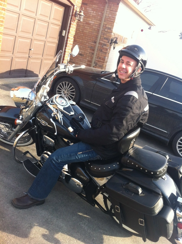 my husband sitting on his new true love, his motorcycle